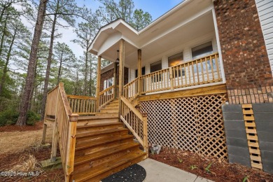 Welcome to 806 Wind Way - a hidden gem nestled in the gated on Harbour Point Golf Club in North Carolina - for sale on GolfHomes.com, golf home, golf lot