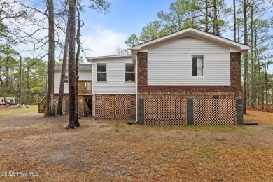 Welcome to 806 Wind Way - a hidden gem nestled in the gated on Harbour Point Golf Club in North Carolina - for sale on GolfHomes.com, golf home, golf lot