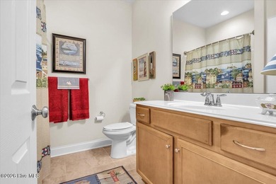 Experience coastal living in its meticulously maintained on South Harbour Golf Links in North Carolina - for sale on GolfHomes.com, golf home, golf lot