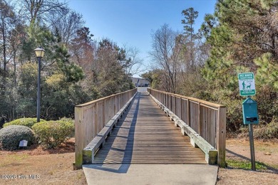 Experience coastal living in its meticulously maintained on South Harbour Golf Links in North Carolina - for sale on GolfHomes.com, golf home, golf lot