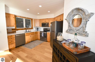 Welcome to this stunning home! Chimney Ridge 8 is situated along on Mountain Flowers Golf Course in Michigan - for sale on GolfHomes.com, golf home, golf lot