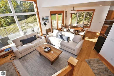 Welcome to this stunning home! Chimney Ridge 8 is situated along on Mountain Flowers Golf Course in Michigan - for sale on GolfHomes.com, golf home, golf lot