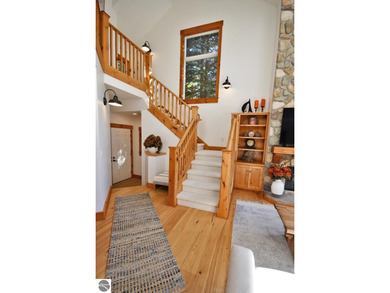 Welcome to this stunning home! Chimney Ridge 8 is situated along on Mountain Flowers Golf Course in Michigan - for sale on GolfHomes.com, golf home, golf lot