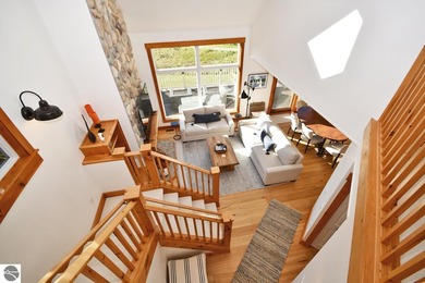 Welcome to this stunning home! Chimney Ridge 8 is situated along on Mountain Flowers Golf Course in Michigan - for sale on GolfHomes.com, golf home, golf lot