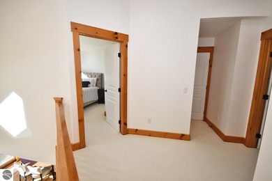 Welcome to this stunning home! Chimney Ridge 8 is situated along on Mountain Flowers Golf Course in Michigan - for sale on GolfHomes.com, golf home, golf lot