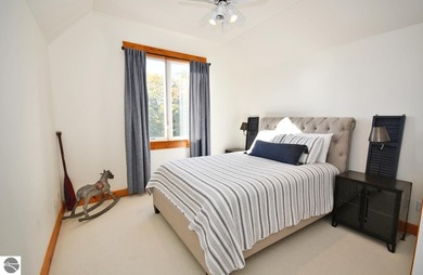 Welcome to this stunning home! Chimney Ridge 8 is situated along on Mountain Flowers Golf Course in Michigan - for sale on GolfHomes.com, golf home, golf lot