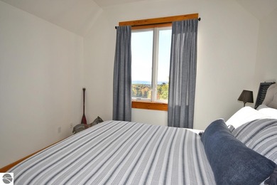 Welcome to this stunning home! Chimney Ridge 8 is situated along on Mountain Flowers Golf Course in Michigan - for sale on GolfHomes.com, golf home, golf lot