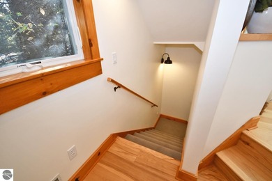 Welcome to this stunning home! Chimney Ridge 8 is situated along on Mountain Flowers Golf Course in Michigan - for sale on GolfHomes.com, golf home, golf lot