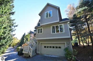 Welcome to this stunning home! Chimney Ridge 8 is situated along on Mountain Flowers Golf Course in Michigan - for sale on GolfHomes.com, golf home, golf lot