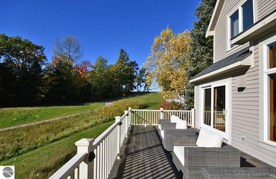 Welcome to this stunning home! Chimney Ridge 8 is situated along on Mountain Flowers Golf Course in Michigan - for sale on GolfHomes.com, golf home, golf lot