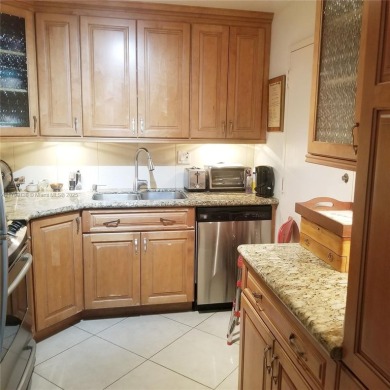 Wake up to treetop views and end your day with a stroll to on Granada Golf Club in Florida - for sale on GolfHomes.com, golf home, golf lot