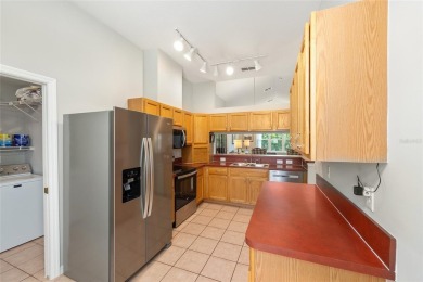 You'll love this beautiful, concrete block stucco home with so on Royal Oaks Golf Club in Florida - for sale on GolfHomes.com, golf home, golf lot