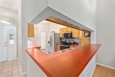 You'll love this beautiful, concrete block stucco home with so on Royal Oaks Golf Club in Florida - for sale on GolfHomes.com, golf home, golf lot