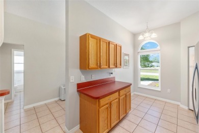 You'll love this beautiful, concrete block stucco home with so on Royal Oaks Golf Club in Florida - for sale on GolfHomes.com, golf home, golf lot