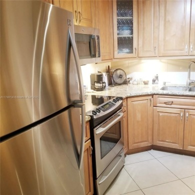 Wake up to treetop views and end your day with a stroll to on Granada Golf Club in Florida - for sale on GolfHomes.com, golf home, golf lot