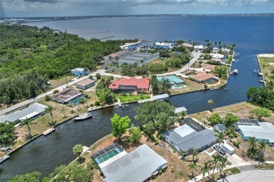 A BOATERS DREAM HOME!! 5 MINUTES TO OPEN WATER, 60 MINUTES TO on Port Charlotte Golf Club in Florida - for sale on GolfHomes.com, golf home, golf lot