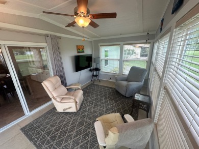 This beautiful Palm Harbour stucco home is located on the golf on Del Tura Golf and Country Club in Florida - for sale on GolfHomes.com, golf home, golf lot