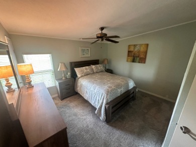 This beautiful Palm Harbour stucco home is located on the golf on Del Tura Golf and Country Club in Florida - for sale on GolfHomes.com, golf home, golf lot