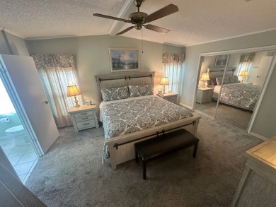 This beautiful Palm Harbour stucco home is located on the golf on Del Tura Golf and Country Club in Florida - for sale on GolfHomes.com, golf home, golf lot