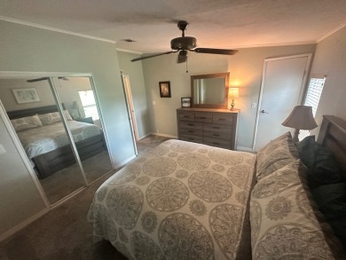 This beautiful Palm Harbour stucco home is located on the golf on Del Tura Golf and Country Club in Florida - for sale on GolfHomes.com, golf home, golf lot