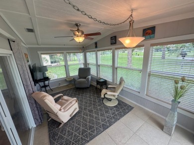 This beautiful Palm Harbour stucco home is located on the golf on Del Tura Golf and Country Club in Florida - for sale on GolfHomes.com, golf home, golf lot