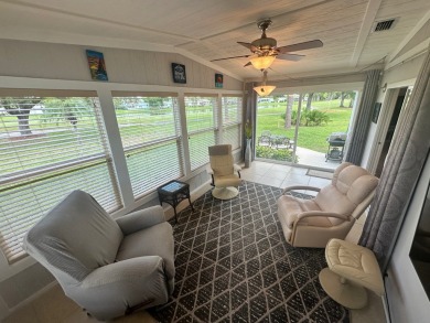 This beautiful Palm Harbour stucco home is located on the golf on Del Tura Golf and Country Club in Florida - for sale on GolfHomes.com, golf home, golf lot