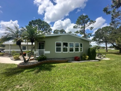 This beautiful Palm Harbour stucco home is located on the golf on Del Tura Golf and Country Club in Florida - for sale on GolfHomes.com, golf home, golf lot