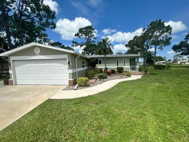 This beautiful Palm Harbour stucco home is located on the golf on Del Tura Golf and Country Club in Florida - for sale on GolfHomes.com, golf home, golf lot