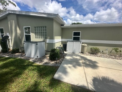 This beautiful Palm Harbour stucco home is located on the golf on Del Tura Golf and Country Club in Florida - for sale on GolfHomes.com, golf home, golf lot