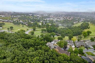 Nestled on a desirable corner lot, this exquisite 2-bedroom, 2 on Pointe Royale Village Country Club in Missouri - for sale on GolfHomes.com, golf home, golf lot