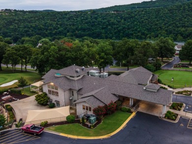 Nestled on a desirable corner lot, this exquisite 2-bedroom, 2 on Pointe Royale Village Country Club in Missouri - for sale on GolfHomes.com, golf home, golf lot