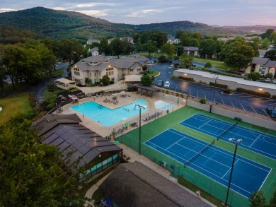 Nestled on a desirable corner lot, this exquisite 2-bedroom, 2 on Pointe Royale Village Country Club in Missouri - for sale on GolfHomes.com, golf home, golf lot