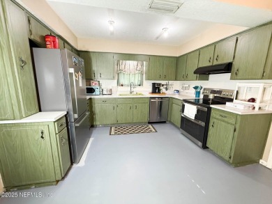 This 2 story, 4-bedroom, 2-bath home is nestled in an area near on Starke Golf and Country Club in Florida - for sale on GolfHomes.com, golf home, golf lot