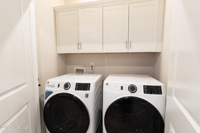 Discover Your Own Slice of Paradise! This stunning 2-bedroom on Brunswick Plantation and Golf Resorts in North Carolina - for sale on GolfHomes.com, golf home, golf lot