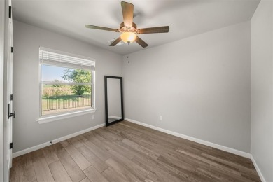 Lock in an assumable 2.5% interest rate and a home that's truly on Lakeside Golf Course in Oklahoma - for sale on GolfHomes.com, golf home, golf lot