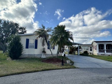 This charming home is perfectly located near the clubhouse and on Four Lakes Golf Club in Florida - for sale on GolfHomes.com, golf home, golf lot