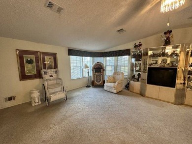 This charming home is perfectly located near the clubhouse and on Four Lakes Golf Club in Florida - for sale on GolfHomes.com, golf home, golf lot