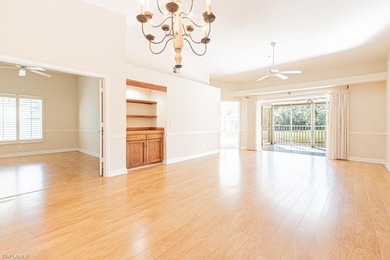 Welcome to this beautifully maintained second-floor veranda on Naples Heritage Golf and Country Club in Florida - for sale on GolfHomes.com, golf home, golf lot