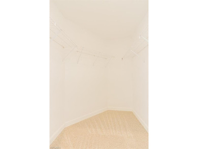 Welcome to this beautifully maintained second-floor veranda on Naples Heritage Golf and Country Club in Florida - for sale on GolfHomes.com, golf home, golf lot