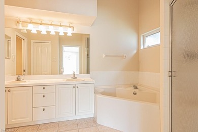 Welcome to this beautifully maintained second-floor veranda on Naples Heritage Golf and Country Club in Florida - for sale on GolfHomes.com, golf home, golf lot