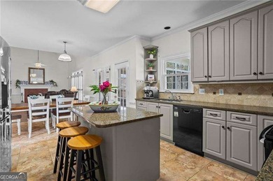 Welcome home to this timeless brick traditional nestled at the on Brookstone Golf and Country Club in Georgia - for sale on GolfHomes.com, golf home, golf lot