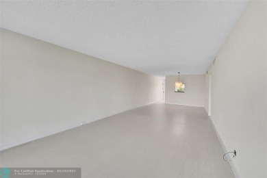ARUBA VILLAGE IN THE HEART OF WYNMOOR WITH PANORAMIC GOLF COURSE on Wynmoor Golf Course in Florida - for sale on GolfHomes.com, golf home, golf lot