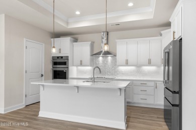 Ranch living at its best in this Promenade III Plan with on Ocean Ridge Plantation in North Carolina - for sale on GolfHomes.com, golf home, golf lot