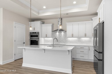 Ranch living at its best in this Promenade III Plan with on Ocean Ridge Plantation in North Carolina - for sale on GolfHomes.com, golf home, golf lot