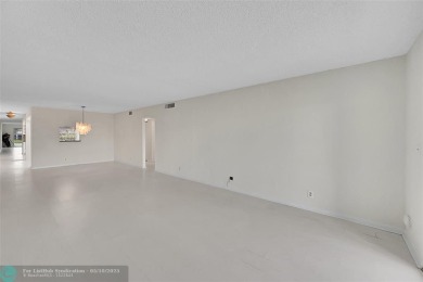 ARUBA VILLAGE IN THE HEART OF WYNMOOR WITH PANORAMIC GOLF COURSE on Wynmoor Golf Course in Florida - for sale on GolfHomes.com, golf home, golf lot