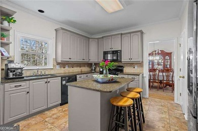 Welcome home to this timeless brick traditional nestled at the on Brookstone Golf and Country Club in Georgia - for sale on GolfHomes.com, golf home, golf lot