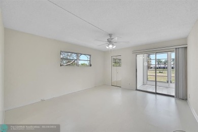 ARUBA VILLAGE IN THE HEART OF WYNMOOR WITH PANORAMIC GOLF COURSE on Wynmoor Golf Course in Florida - for sale on GolfHomes.com, golf home, golf lot