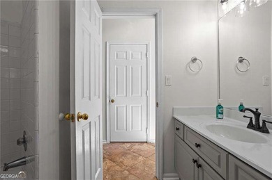 Welcome home to this timeless brick traditional nestled at the on Brookstone Golf and Country Club in Georgia - for sale on GolfHomes.com, golf home, golf lot