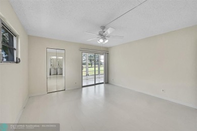 ARUBA VILLAGE IN THE HEART OF WYNMOOR WITH PANORAMIC GOLF COURSE on Wynmoor Golf Course in Florida - for sale on GolfHomes.com, golf home, golf lot