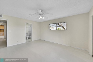 ARUBA VILLAGE IN THE HEART OF WYNMOOR WITH PANORAMIC GOLF COURSE on Wynmoor Golf Course in Florida - for sale on GolfHomes.com, golf home, golf lot